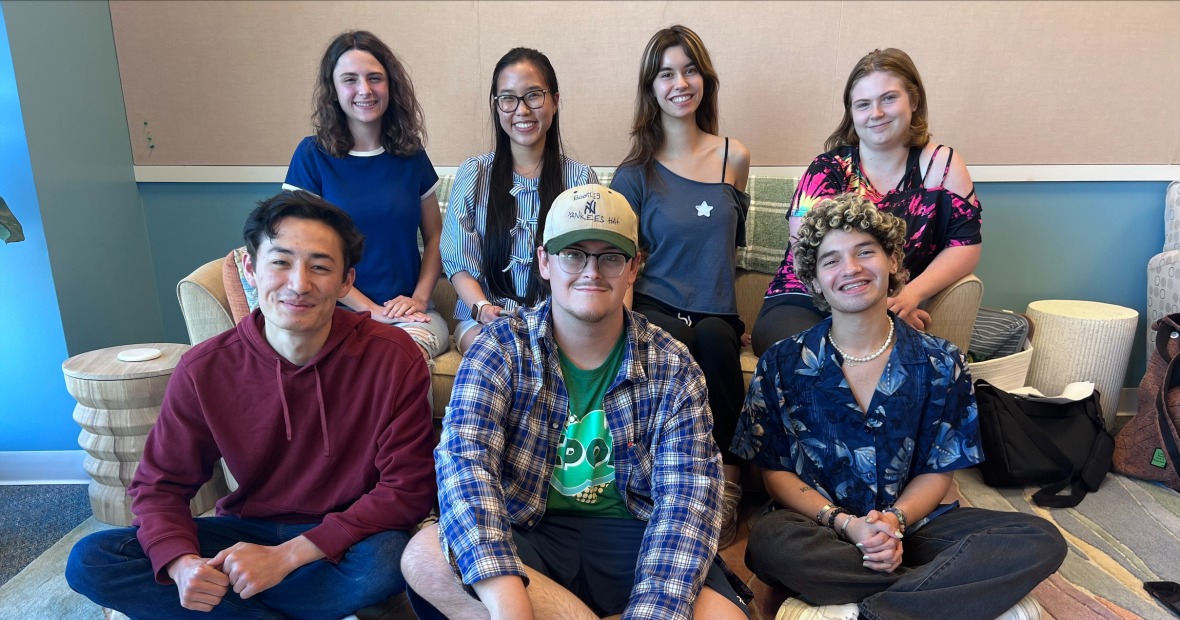 seven student leaders sit on the couch in the FGLI center
