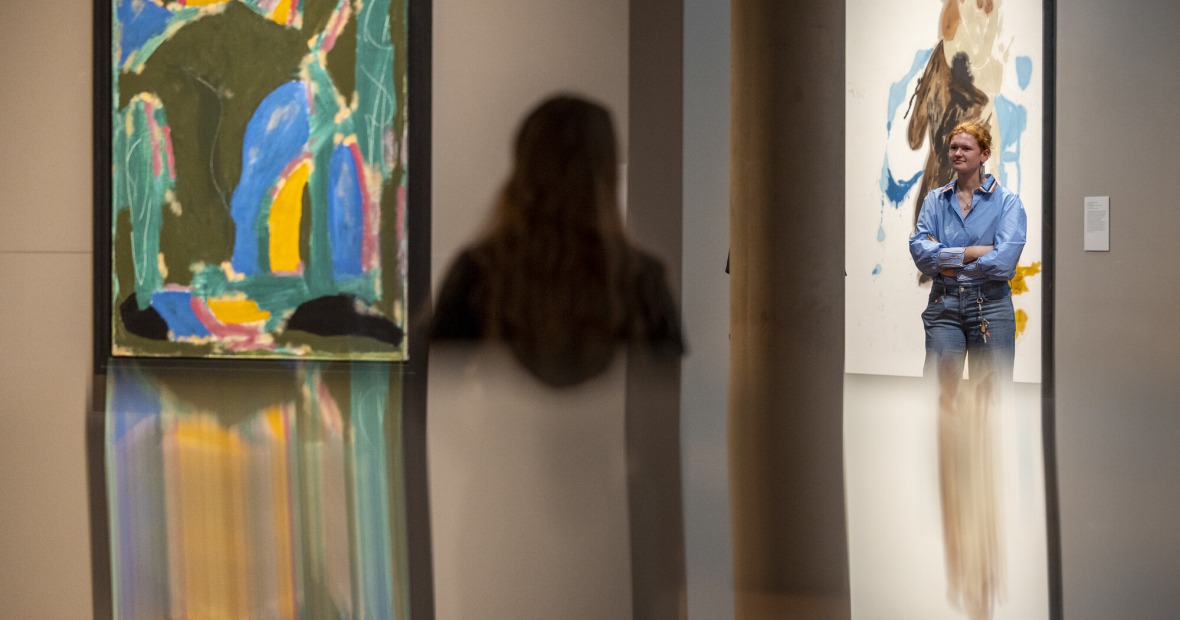 two people looking at art