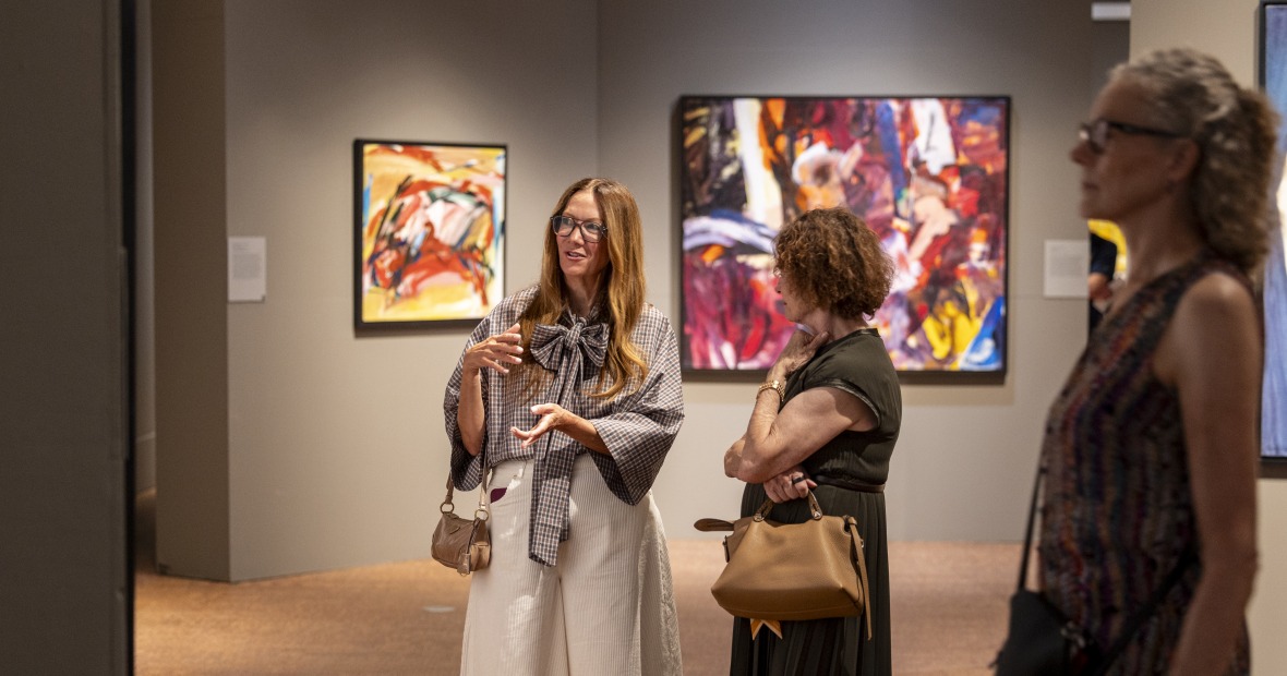 3 people looking at art in the gallery