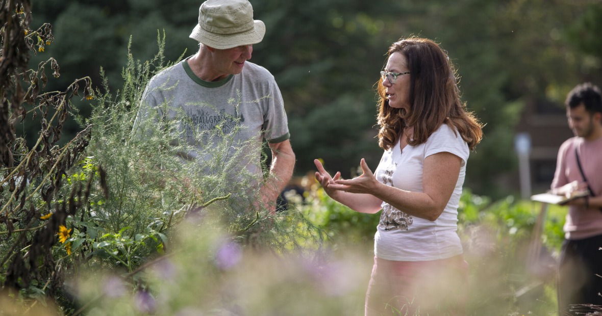 Professor Jon Andelson chats in the College Garden