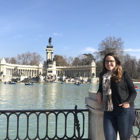 Natalie Gentil stands in front of the pond at Retiro Park in Madrid