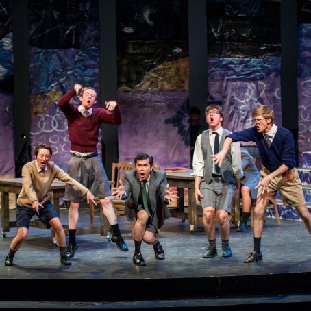 Five enthusiastic performers in a student production of Spring Awakening