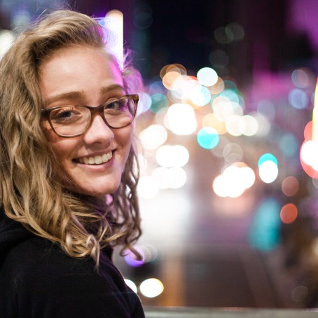 Photo of Katie Goodall on a city street at night