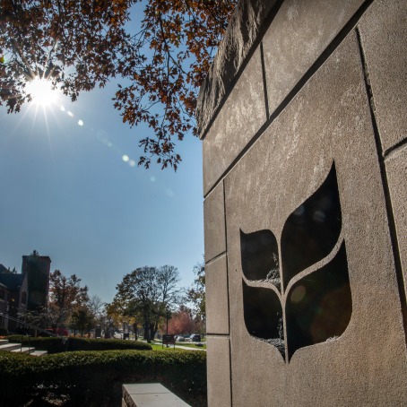 Grinnell College logo on stone gateway