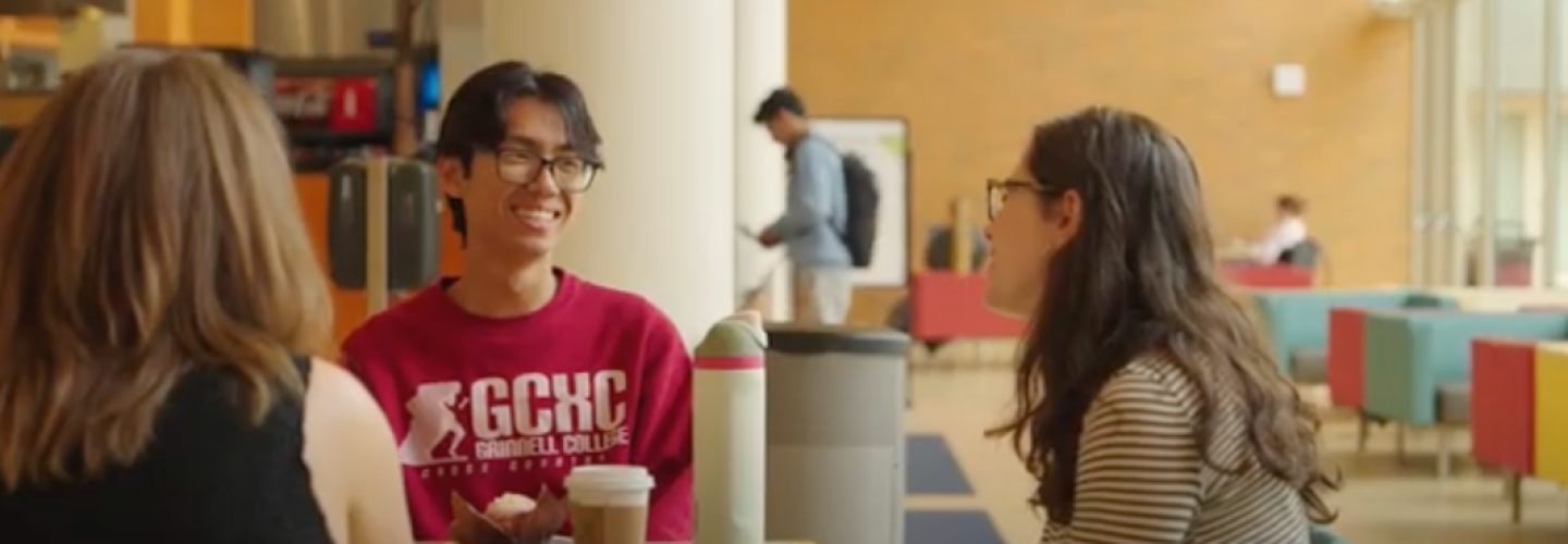 students talk and smile over drinks and snacks at the Spencer Grill