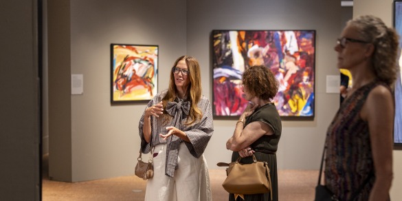 3 people looking at art in the gallery