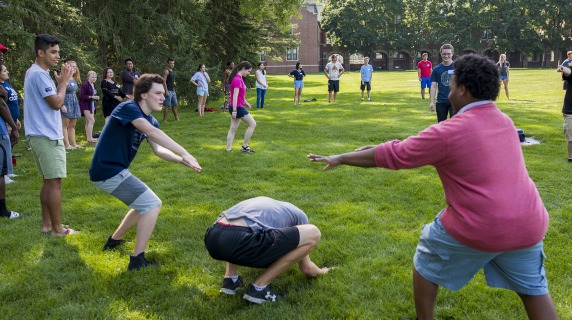 Students outside playing a lawn game during PCPOP