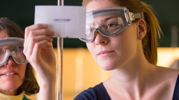 Leslie Lyons, Professor of Chemistry, works with a student in one of the labs in Noyce