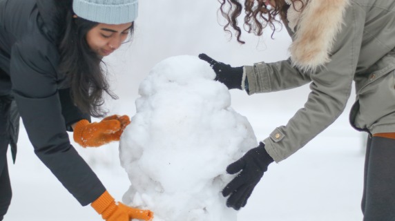 students building snowman