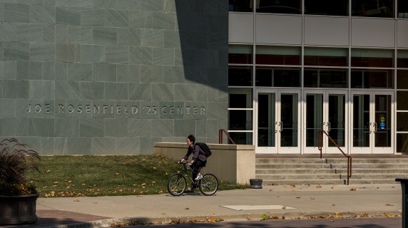 Student on bike outside JRC