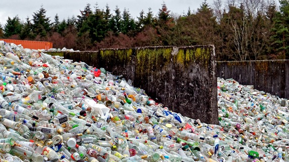 huge piles of trash at a landfill