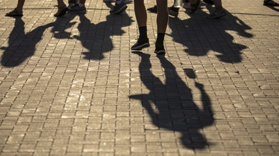 Shadows of people walking