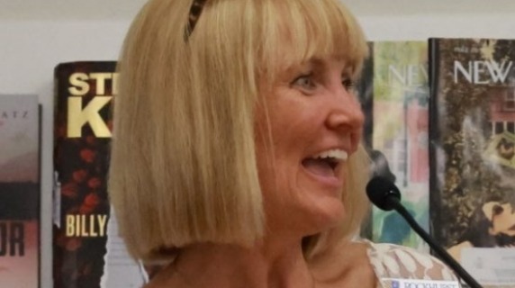 Diane J. Marty at a microphone
