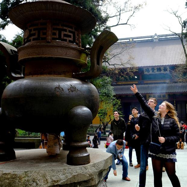 Student points at statue in China