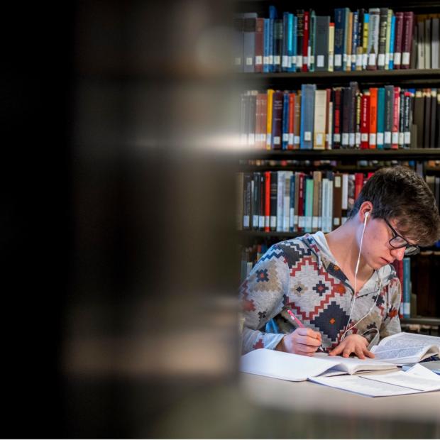 student studying in library
