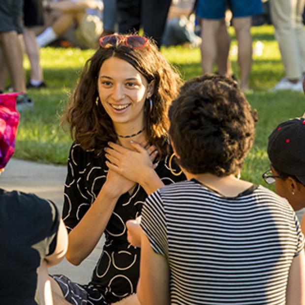 Students chat at the all campus picnic