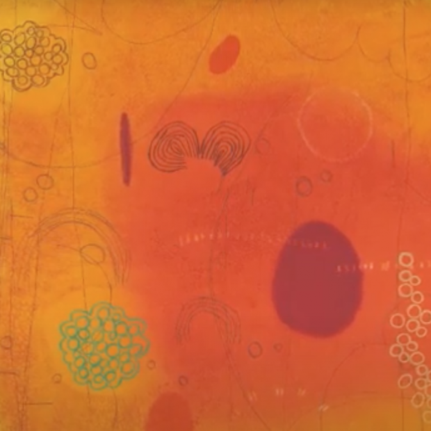 Abstract print with floating circular forms floating on a nebulous red and orange background