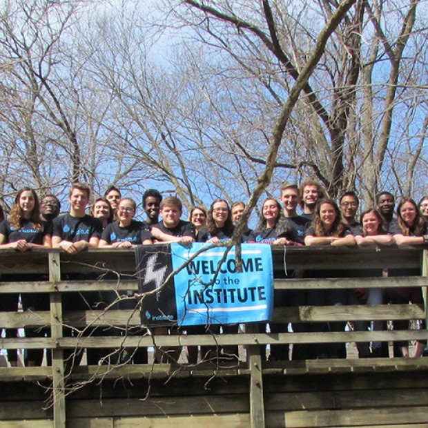 All participants stand on a bridge together at Leadershape Retreat, 2017