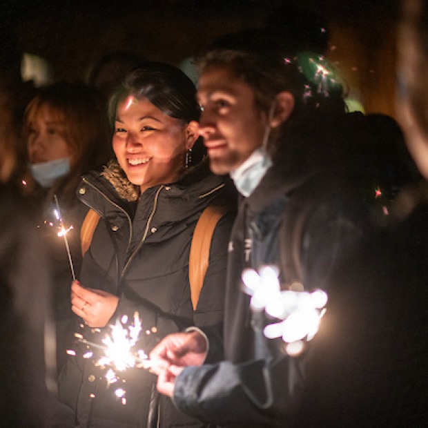 Students celebrate with sparklers at Arctic Lights