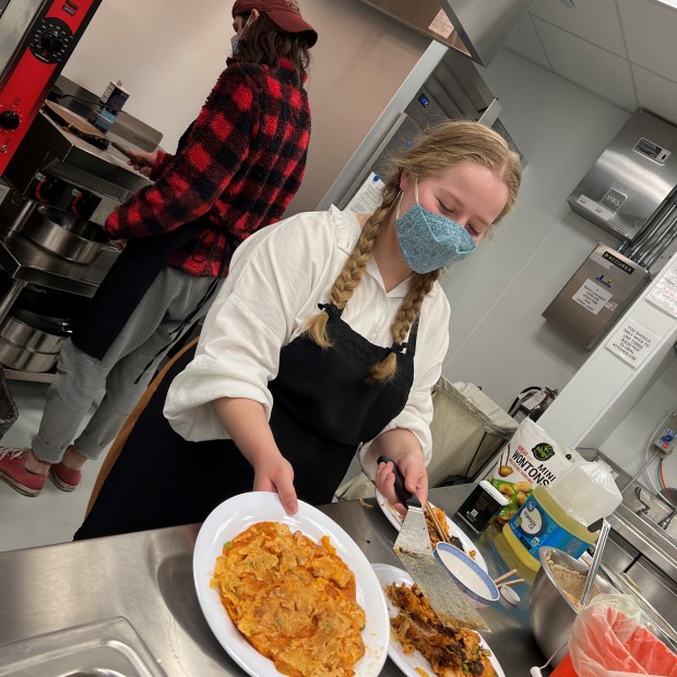 Student Showcasing food prepared at the Global Kitchen