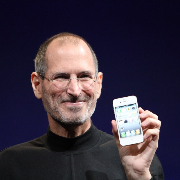 Steve Jobs holding early iPhone