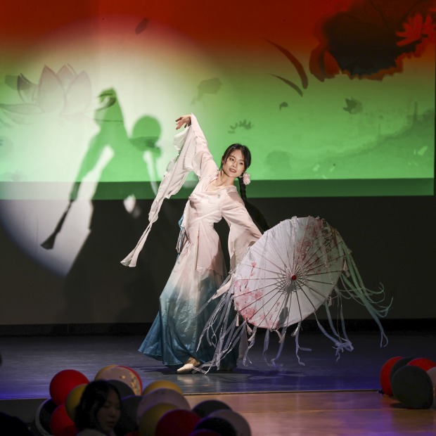 a woman performs on stage