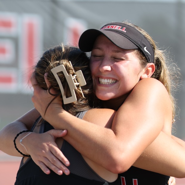 female tennis players embrace