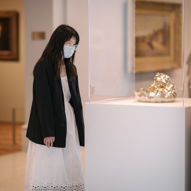 Amy Kan looking at object in art gallery