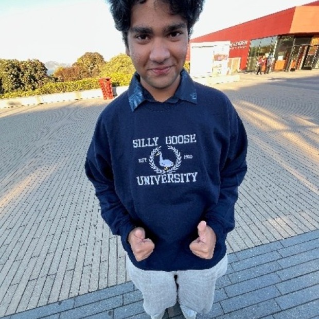 Aaryan smiling at the photographer