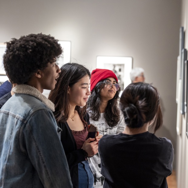 Group of students looking at art in gallery