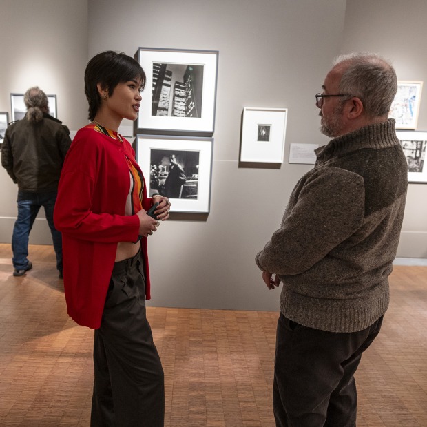 Professor Mackenzie speaking with student
