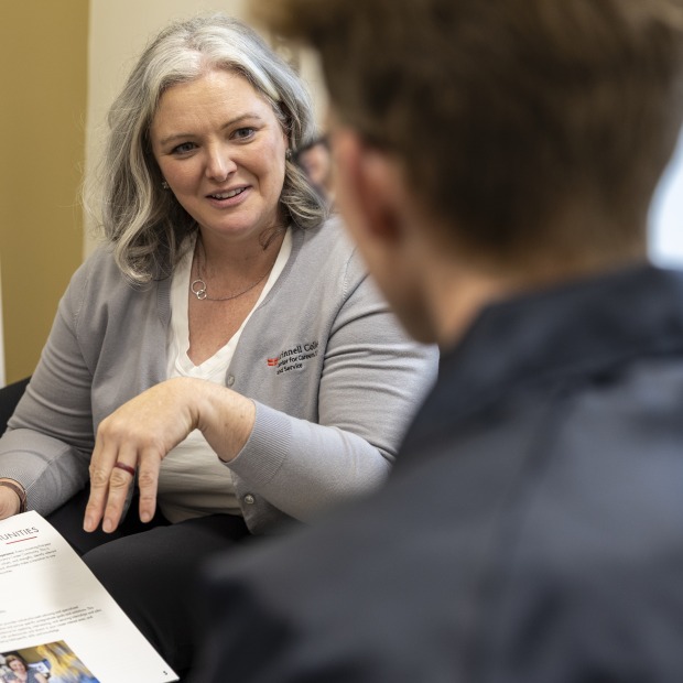A career adviser talks to a student