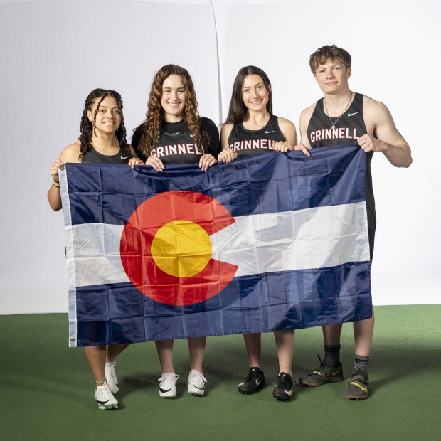 Grinnell students hold a Colorado flag