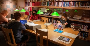 students and faculty doing research in Grinnell College archives