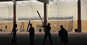 Dark figures hold DAG weapons 