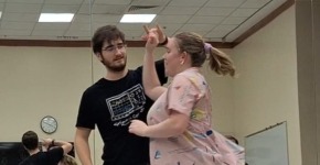 Two people swing dancing