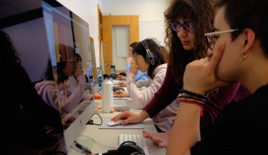 students look at computer screens