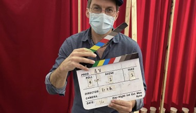Craig Quintero holds up a clapperboard