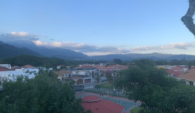 The city of San Pedro Sula, Honduras, viewed from above with mountains around it