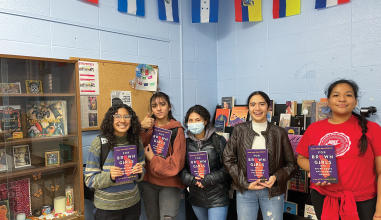 Five women hold copies of For Brown Girls with Sharp Edges and Tender Hearts