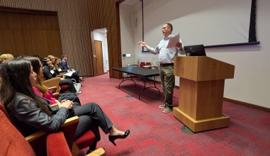 Brian Farrell of the U of I College of Law and, the U of I Center for Human Rights welcomes attendees.