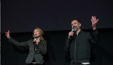 Andrew Sherburne '01 welcomes an audience alongside director Ondi Timoner (DIG!).