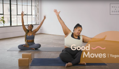 Screenshot of Good Moves Yoga. Two women, one of slender build and one of a heavier build, sit on mats raising their arms in a yoga pose. 