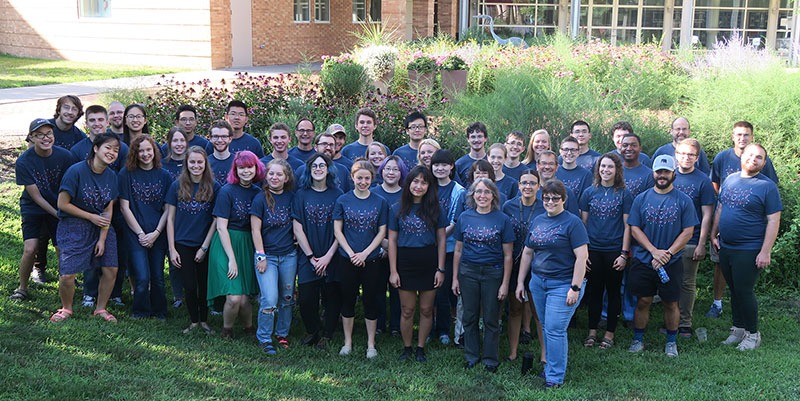 Students designed the group T-shirts seen in this photo of the chemistry summer research students, faculty, and staff.