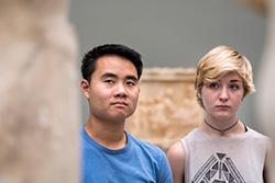 Bryce Lew and another student contemplate a sculpture at a Copenhagen museum