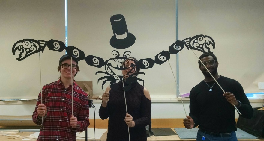 Students holding a shadow puppet