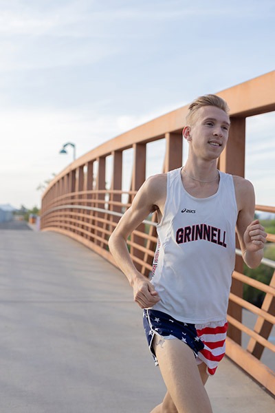 Adam Dalton ’16 running on a bridge
