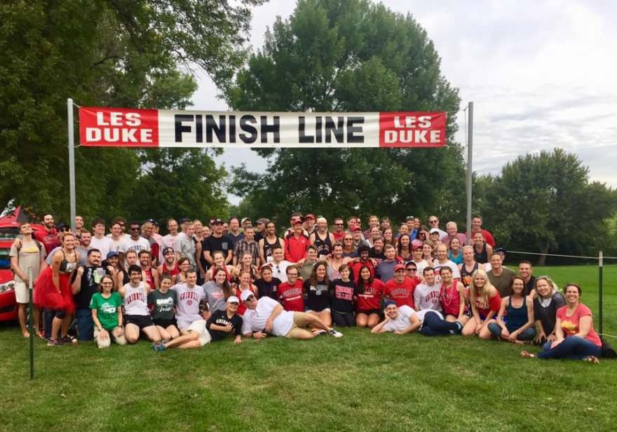 Alums and students gather at the finish line of the Les Duke invitational