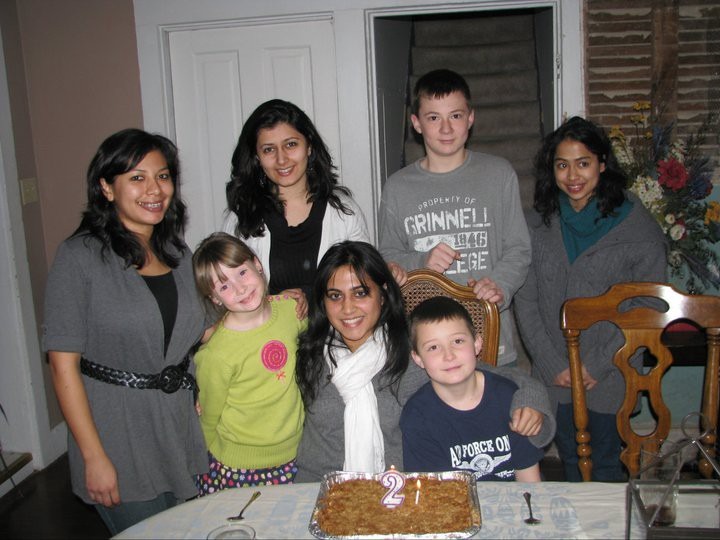 Sneha Saigal ’12 and her American host family on her 21st birthday with apple crisp