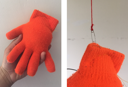 Images of a winter glove filled and suspended